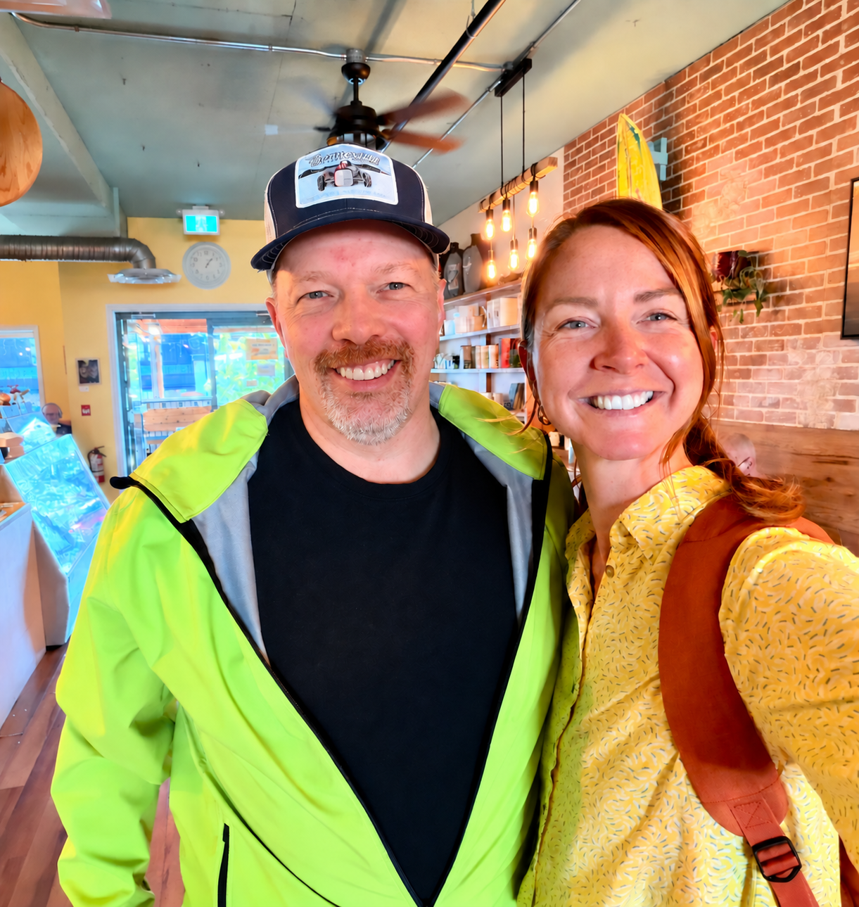 Two members smiling in a café