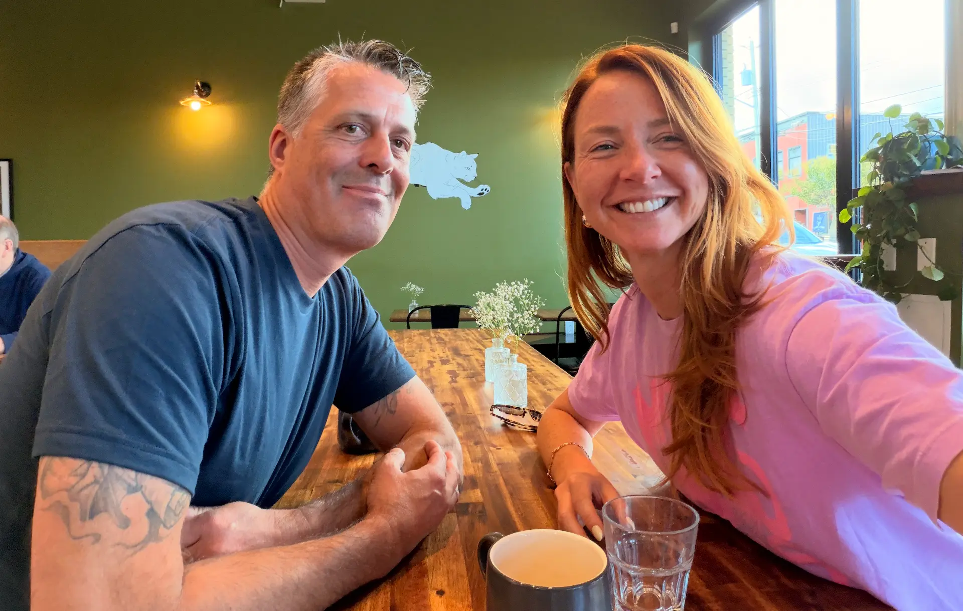 Two members at a café table
